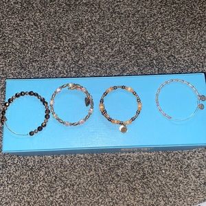Group of brown alex and ani bracelets